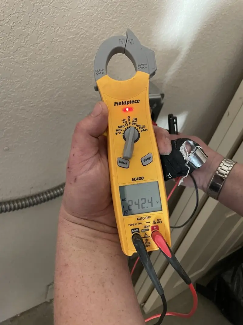 Voltage testing with clamp meter during Hot Tub / Pool Electrical Wiring in Salina
